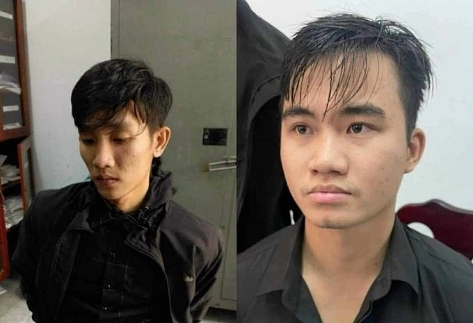 Nghi phạm Nguyễn Mạnh Cường (phải) và Trần Văn Trí được xác định đã dùng súng để cướp một chi nhánh ngân hàng ở Đà Nẵng. 	Ảnh: Công an cung cấp